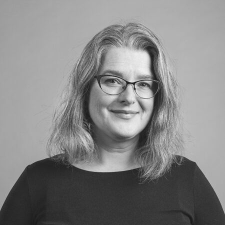A black and white portrait photo of NBCCD's Ceramics Studio Head Liz Demerson.