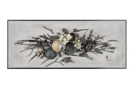 A table setting made out of silver bowls and leaves crafted out of silver, made by Brigitte Clavette.
