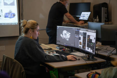 Student at computer building 3D digital design modules at the New Brunswick College of Craft and Design.