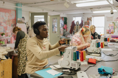 Students at work in the NBCCD Fashion Design Studio.