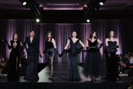 Student designer, Anahita Dizgah posing on the runway with models at the NBCCD Fashion Show 2024.
