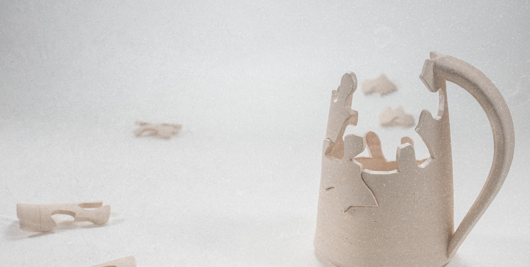 A ceramic mug constructed from interlocking puzzle pieces.